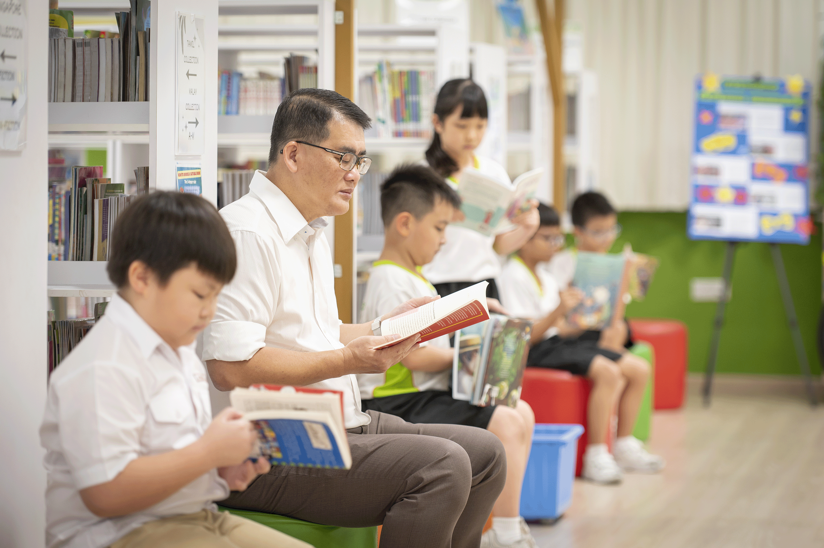 A joyful moment of reading with SKGians in the Learning Hub
